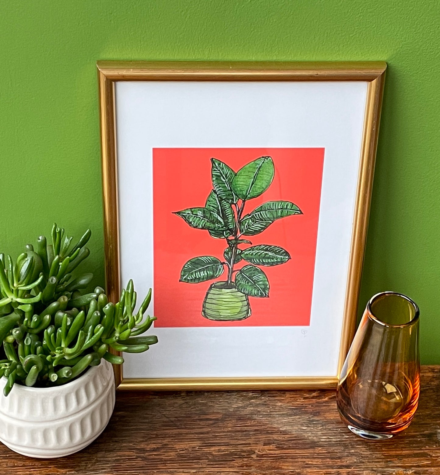 A5 print of a rubber plant, on a vibrant red background