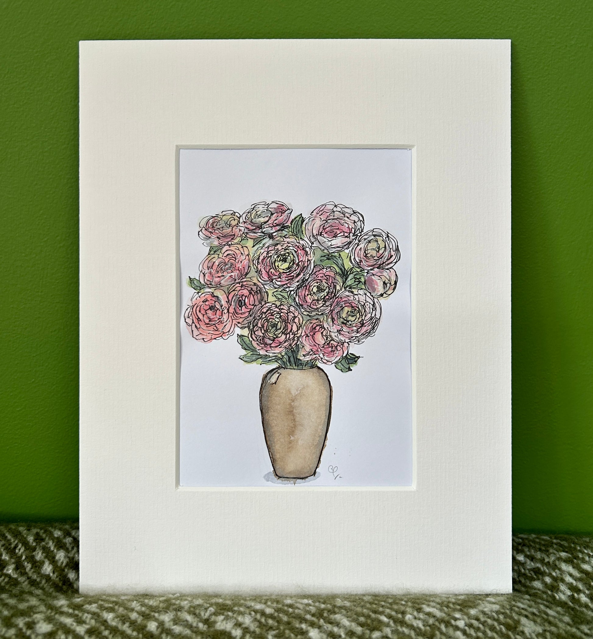 An A6 (postcard sized) watercolour and ink pen illustration of a vase of pink ranunculus.