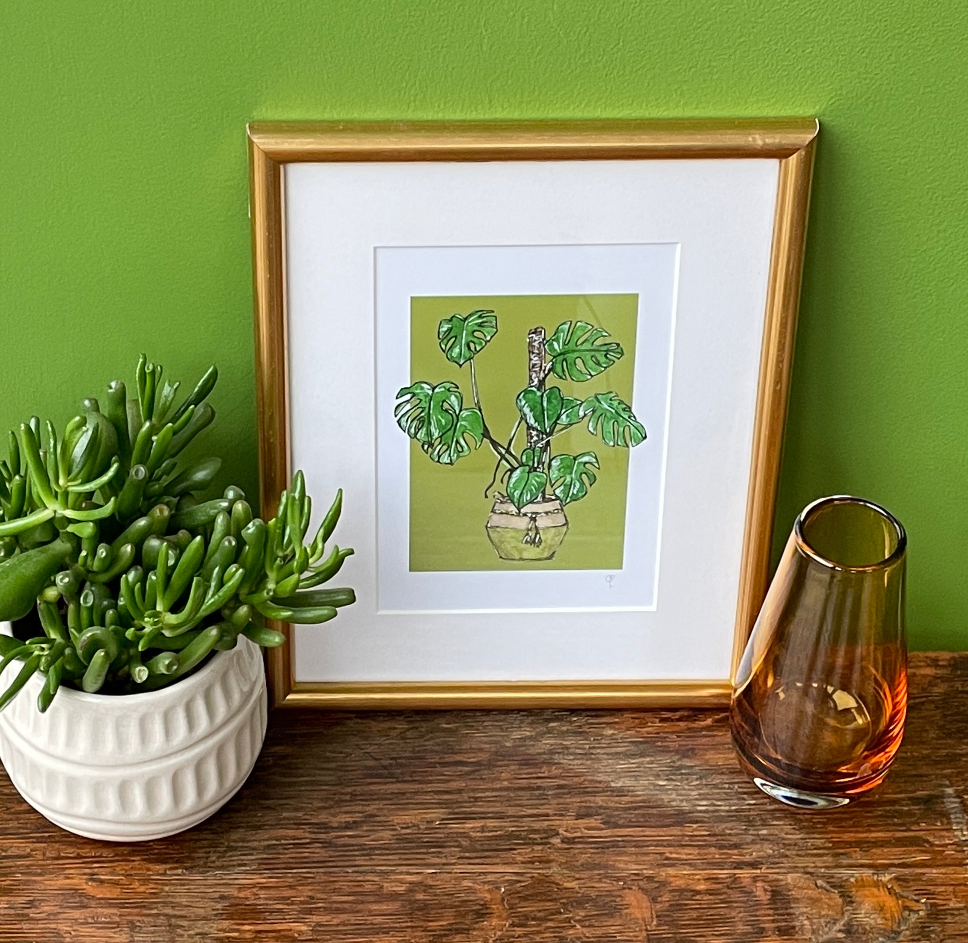 A5 print of a Monstera or Swiss Cheese plant on a bold green background 